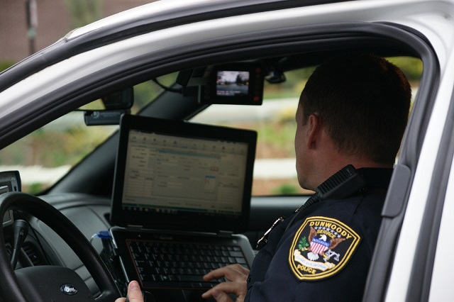 Officer looking at dispatch computer