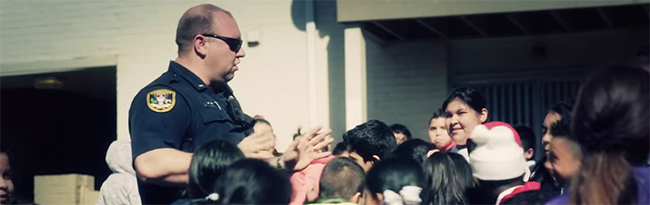 Officer talking to children