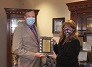 Eric Linton & Linda Nabers pose with the GFOA Award masks thumbnail