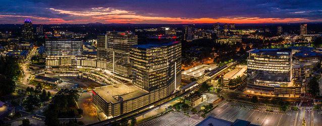 State Farm building at night with sunset