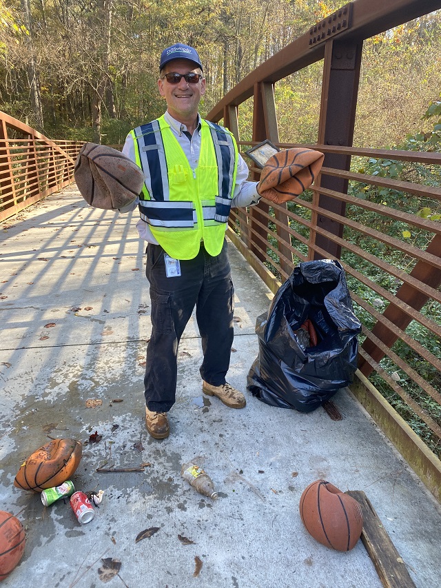 Great Dunwoody Cleanup Tod holds trashed basketballs