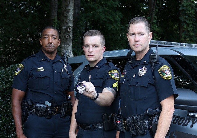 Dunwoody officers hold Sept. 11 anniversary badge