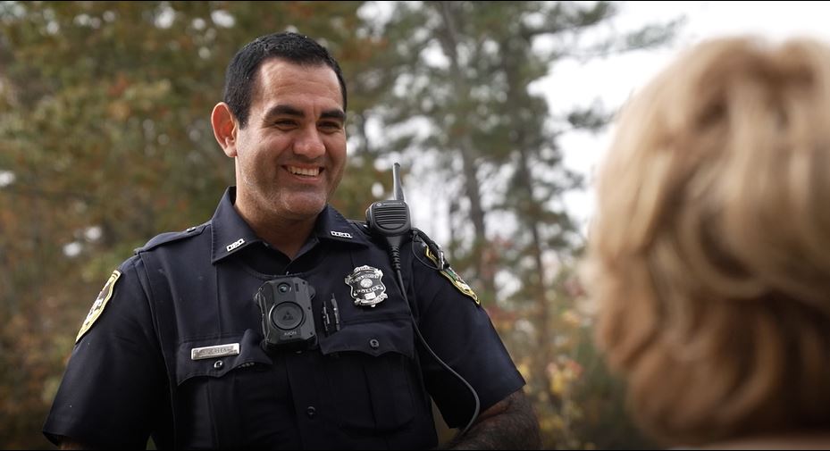 Officer smiling in recruitment video