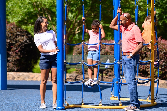 Family playing at Dunwoody's Brook Run Park