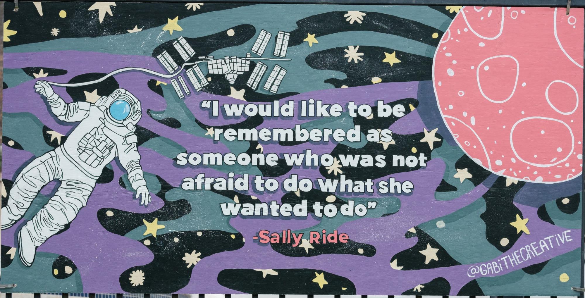 women's history month mural of Sally Ride in space