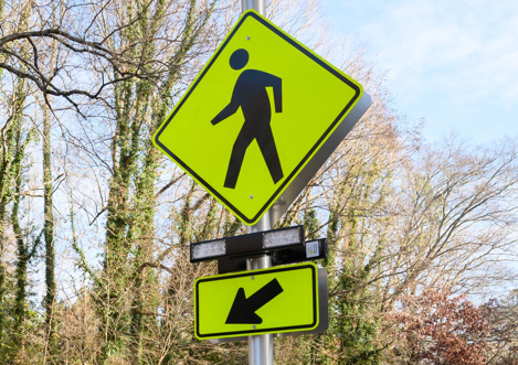 crossing person sign crosswalk