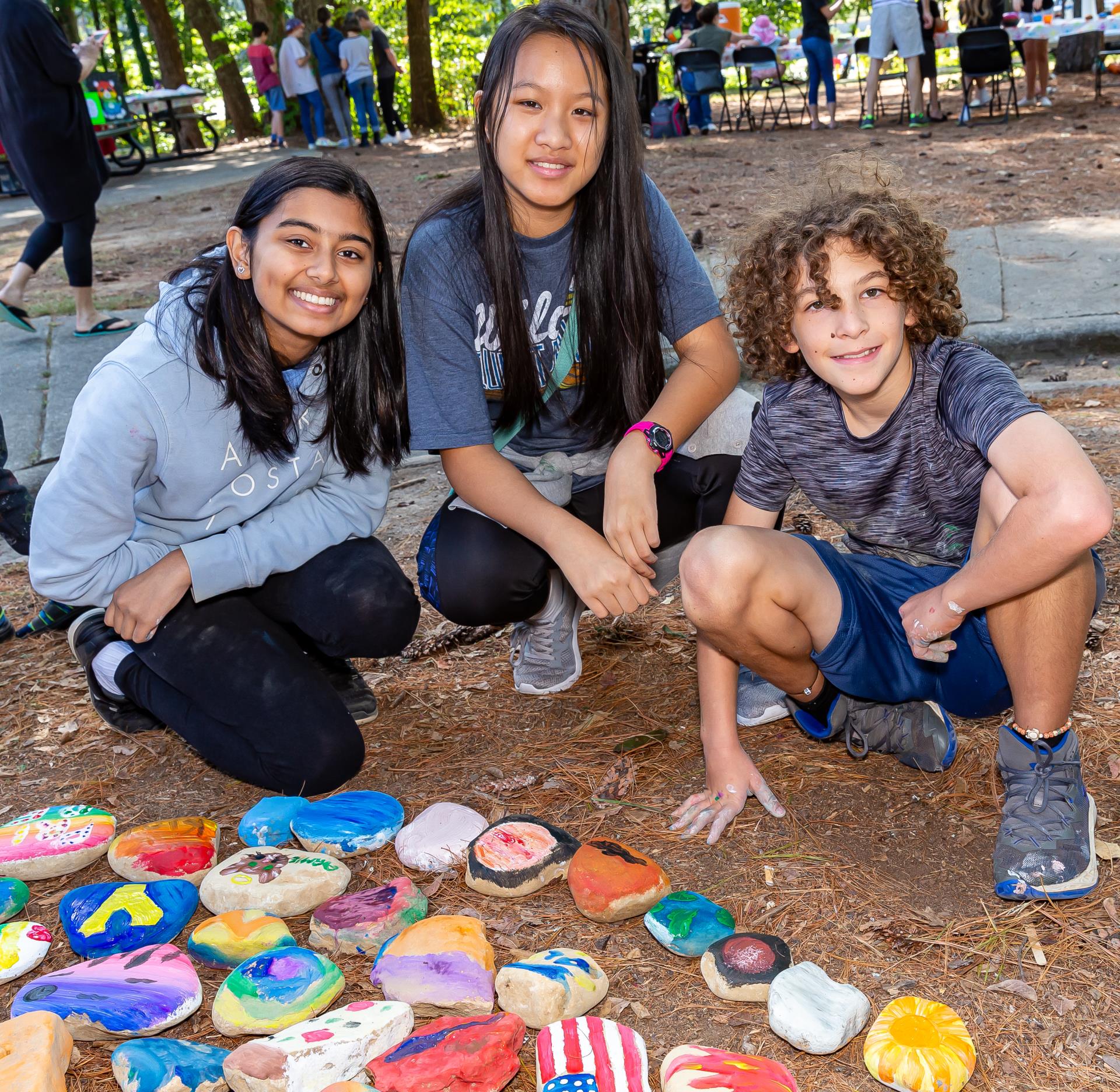 Kids making rock art in the park.